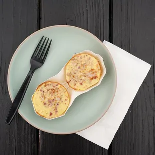 a plate of eggs and a fork