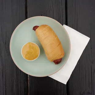 a hot dog wrapped in a blanket