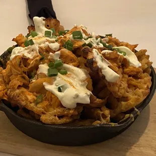 a skillet of food on a table