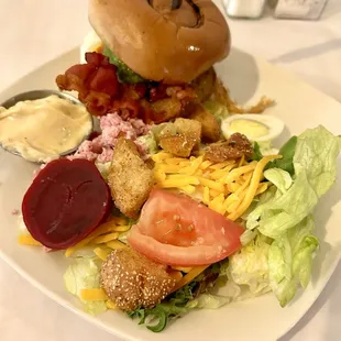 The Local burger: cheese, bacon, avocado, egg with a side of Chef's salad.