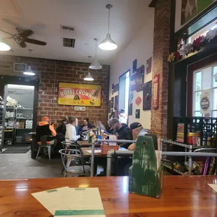 people sitting at tables in a restaurant