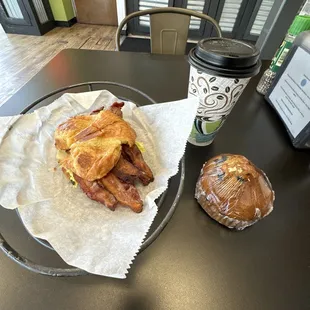 a sandwich and a cup of coffee