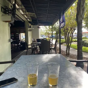 two glasses of beer on a table