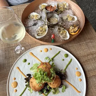 Crab and corn fritters, raw oysters.