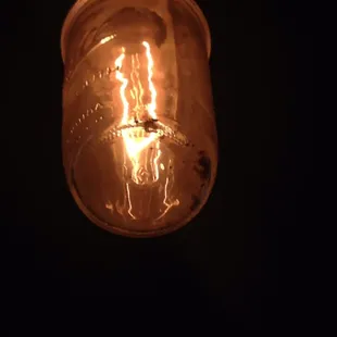 One of the many light fixtures above the bar full of old dead bugs....