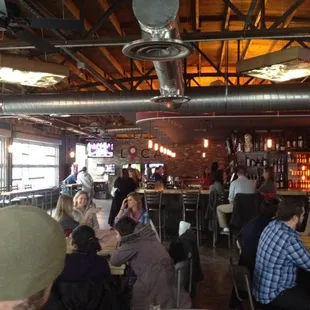 people sitting at tables in a restaurant