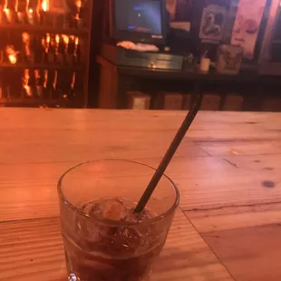 a drink in a glass on a table