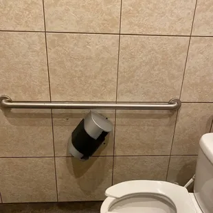 a toilet in a public restroom