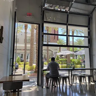 a man sitting at a table in a restaurant