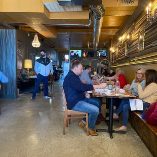 a group of people sitting at a table