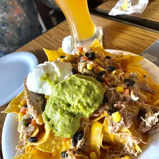 Tasty pulled pork nachos and nice cold Blue moon on draft! $17 &amp; $12!