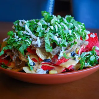 FOUR NAPKIN PULLED PORK NACHOS