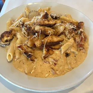 Chicken Sausage &amp; Penne Pasta. Cajun chicken breast w/ andouille sausage, garlic, sun dried tomatoes &amp; creamy white wine Alfredo sauce.