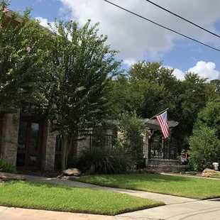 Beautiful building surrounded by plenty of parking.