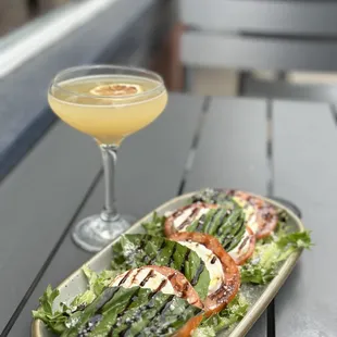 a plate of salad and a drink