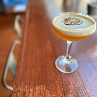 a cocktail sitting on a bar