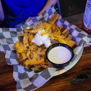 a basket of fries and dip