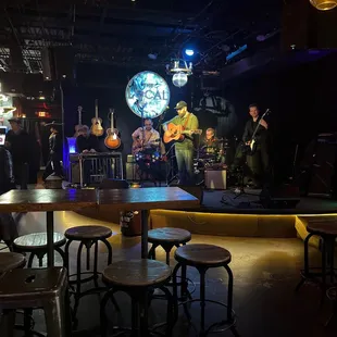 a band playing in a dimly lit bar