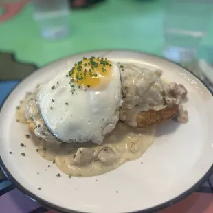 Fried chicken bites on house made biscuits with gravy.