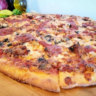 a pizza on a cutting board