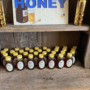 a shelf of honey jars
