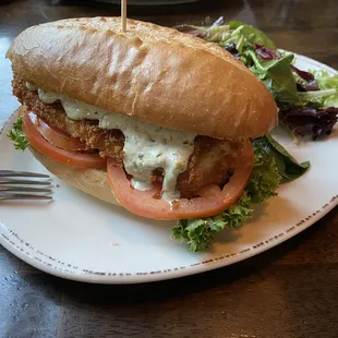 Walleye sandwich and mixed greens