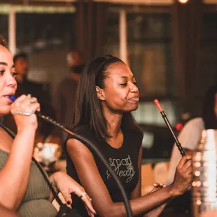 a group of people sitting at a bar