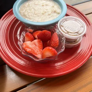 Oatmeal with the side of strawberries