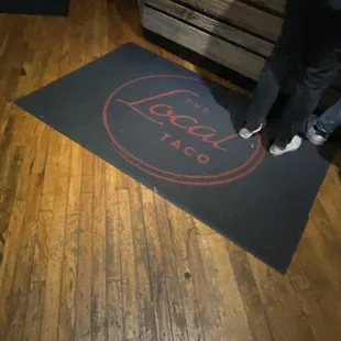 a person standing on a mat