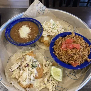 Spicy shrimp tacos, pinto beans, Mexican rice.