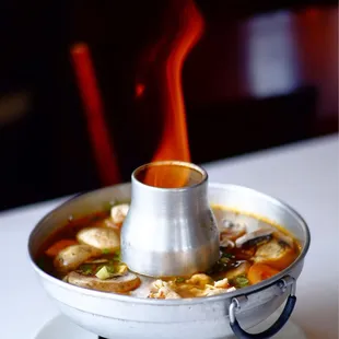 a steaming pot of soup