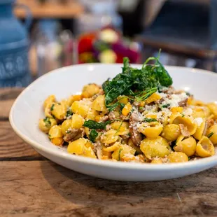  bowl of pasta on a wooden table