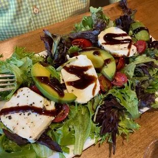 Caprese and avocado salad with fresh mozzarella