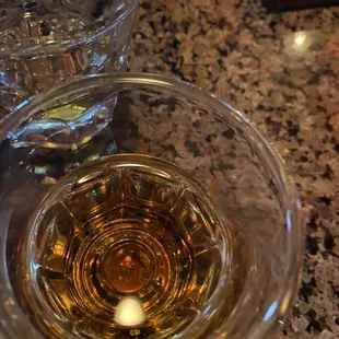 a glass of wine and a candle