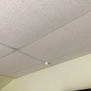 Some type of plastic bag hanging from the ceiling