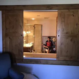 A non-locking "window" looks into the bath from the bedroom. (Dramatic reenactment only. No teens were scarred in the taking of this photo.)