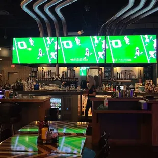 a bar with a green screen