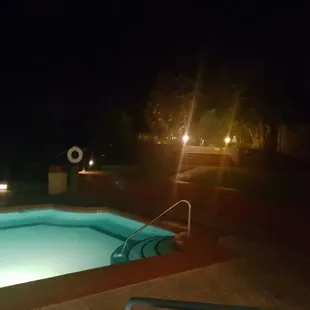 The jacuzzi is located between those those lights