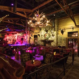 From the moment you gaze upon the stone archway and hand-carved cedar wood entrance, you realize that The Lodge is not your average cabaret.