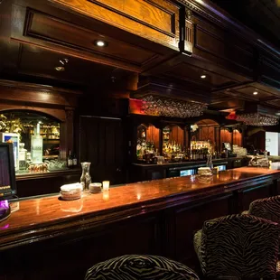 The hand-carved 19th century cherry wood bar in The Library Room.