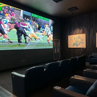 Theatre seating with a HUGE tv.