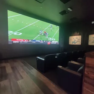 Big screen and comfy chairs to watch the game