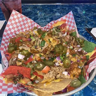 Pulled pork loaded nachos and a Tito's and cran.