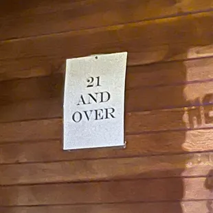 a sign on the wall of a cabin