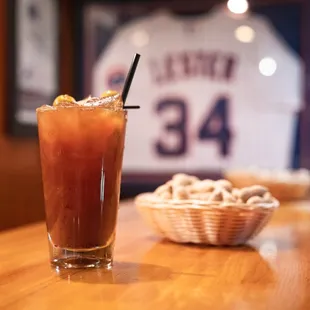 a bloody drink with a baseball jersey in the background