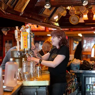 a bartender pouring a drink