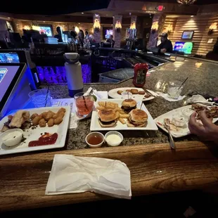 Cheesesteak, pulled pork sliders, loaded potato skins