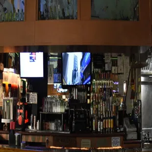 a bar with several televisions