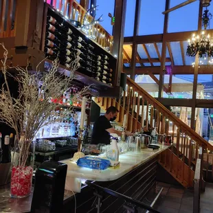 a bar with a chandelier