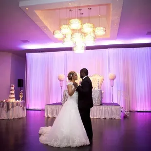 a bride and groom sharing their first dance